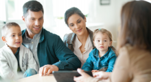 Young family with kids listing their home for sale